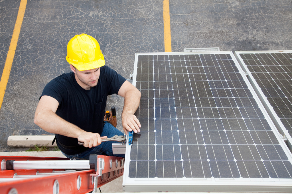 Electrician repairing solar panel